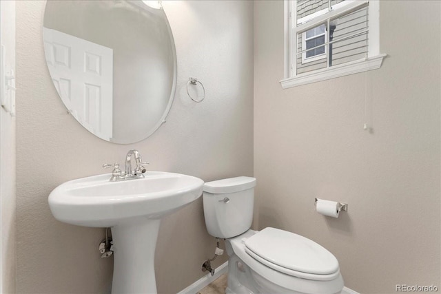 16212 E Geddes Ln Unit 11, Aurora, CO 80016 - bathroom featuring baseboards and toilet