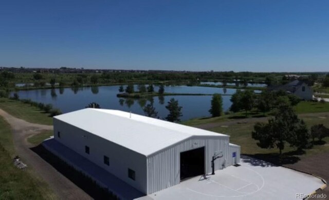 birds eye view of property with a water view