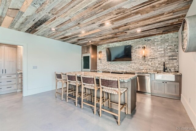 bar with stainless steel dishwasher, wood ceiling, sink, and light stone counters