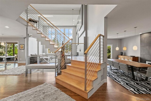 10293 E Sheri Ln, Englewood, CO 80111 - stairs with wood finished floors and recessed lighting