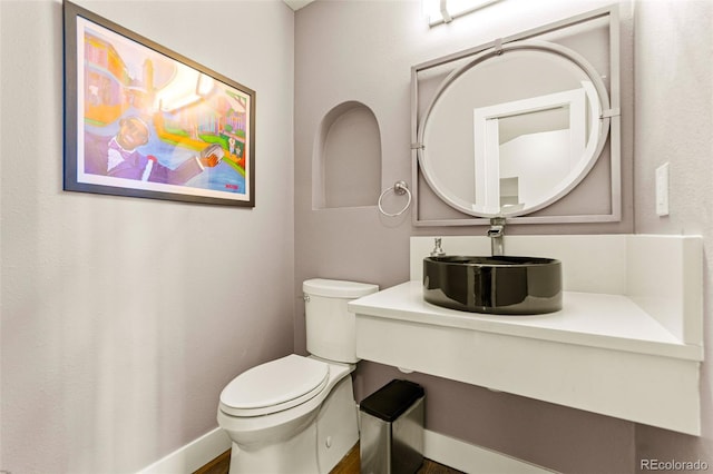 10293 E Sheri Ln, Englewood, CO 80111 - half bathroom featuring a sink and toilet