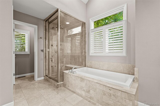 10293 E Sheri Ln, Englewood, CO 80111 - bathroom featuring a garden tub and a shower stall