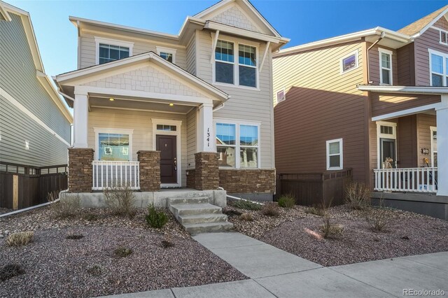 1341 Solitaire St, Colorado Springs, CO 80905 - craftsman house with fence, covered porch, and stone siding