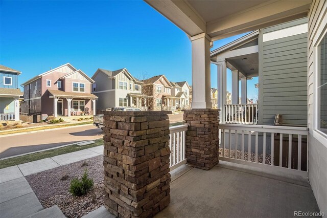 1341 Solitaire St, Colorado Springs, CO 80905 - view of patio with a residential view and a porch