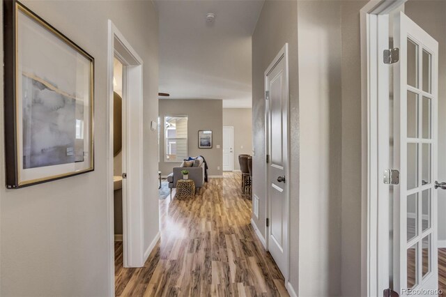 1341 Solitaire St, Colorado Springs, CO 80905 - hallway with baseboards and wood finished floors