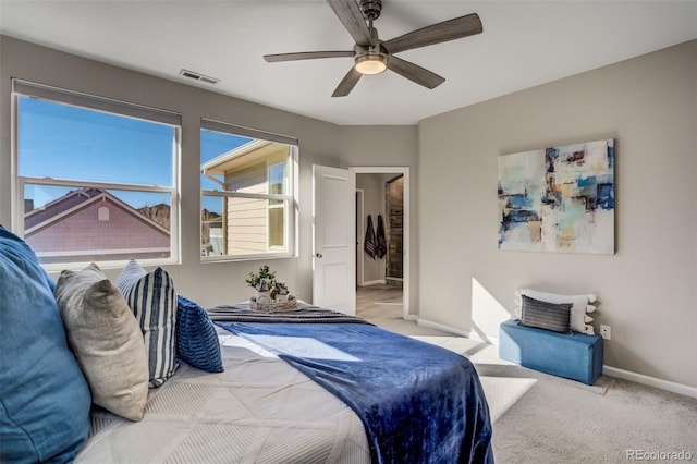 1341 Solitaire St, Colorado Springs, CO 80905 - bedroom with a ceiling fan, light carpet, baseboards, and visible vents