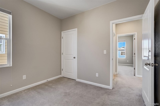 1341 Solitaire St, Colorado Springs, CO 80905 - unfurnished bedroom with baseboards and carpet floors