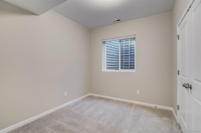 1341 Solitaire St, Colorado Springs, CO 80905 - unfurnished bedroom featuring light carpet, baseboards, and visible vents