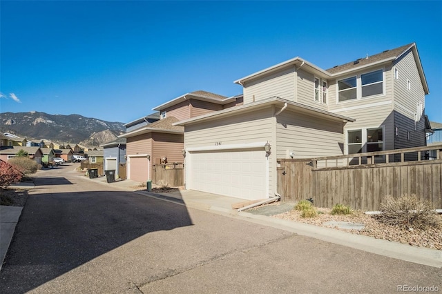 1341 Solitaire St, Colorado Springs, CO 80905 - exterior space with a residential view, driveway, fence, and a mountain view