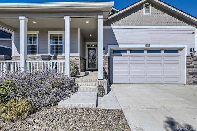 view of front of property featuring covered porch and a garage