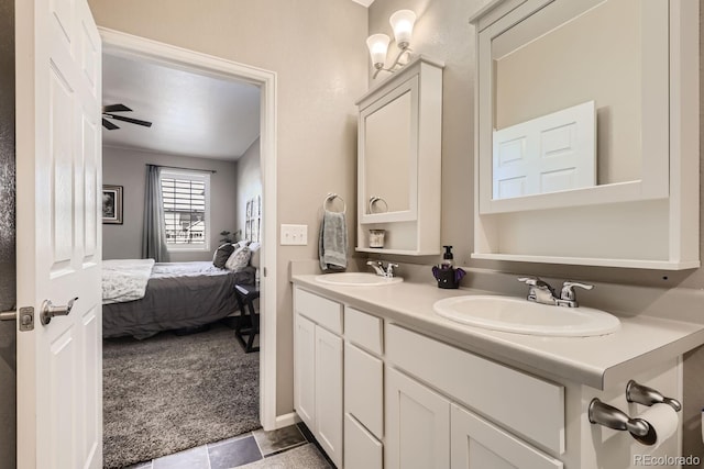 bathroom featuring vanity, tile patterned flooring, and ceiling fan