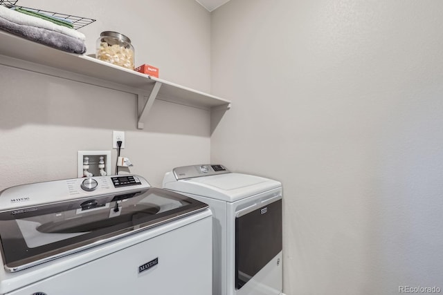 laundry area with washing machine and dryer