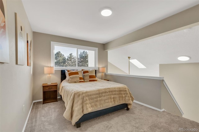 bedroom with lofted ceiling with beams and carpet floors