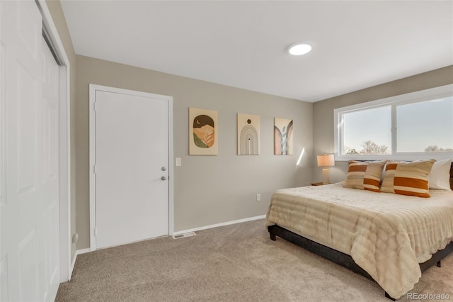 bedroom with light carpet