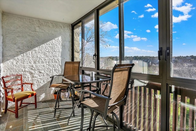 sunroom / solarium featuring floor to ceiling windows