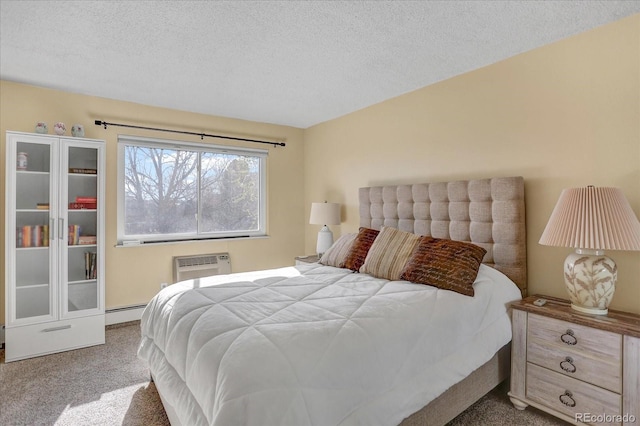 carpeted bedroom featuring a baseboard heating unit, a textured ceiling, and an AC wall unit