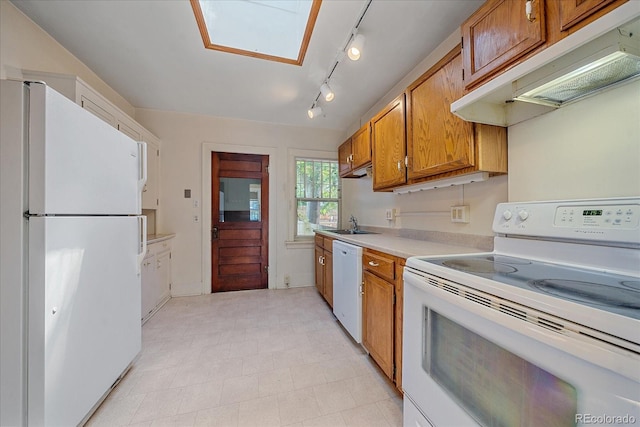 kitchen featuring sink and white appliances