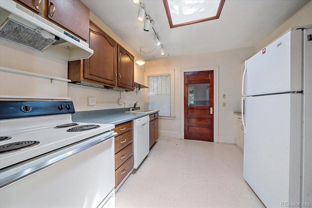 kitchen featuring sink and white appliances