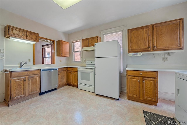 kitchen with sink and white appliances