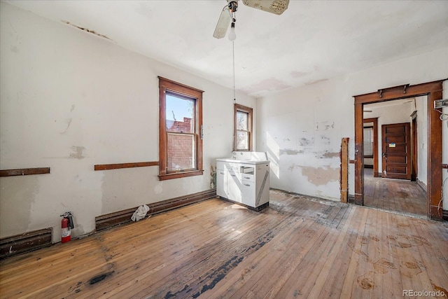 empty room featuring ceiling fan and hardwood / wood-style flooring