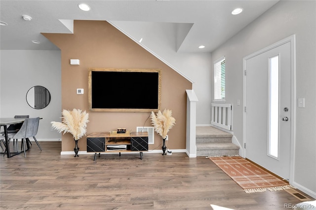 6459 N Dunkirk St, Denver, CO 80249 - entryway featuring wood finished floors, stairs, recessed lighting, and baseboards