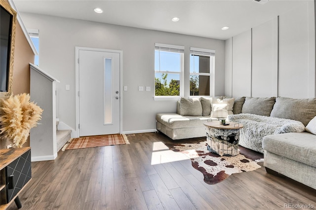 6459 N Dunkirk St, Denver, CO 80249 - living room featuring stairs, dark wood finished floors, baseboards, and recessed lighting