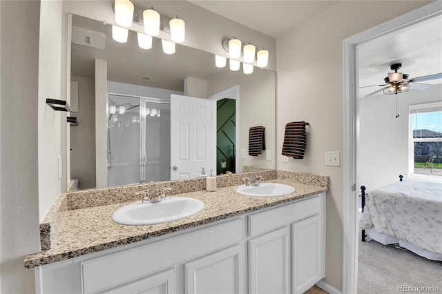 6459 N Dunkirk St, Denver, CO 80249 - full bathroom with a shower stall, ceiling fan, double vanity, and connected bathroom