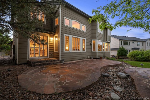 10524 Serengeti Dr, Lone Tree, CO 80124 - back of property featuring a patio area