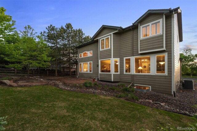 10524 Serengeti Dr, Lone Tree, CO 80124 - rear view of property with central air condition unit and a patio area