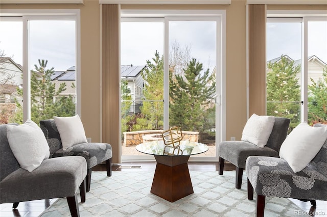 sunroom featuring a wealth of natural light