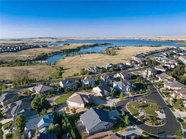 aerial view featuring a residential view and a water view