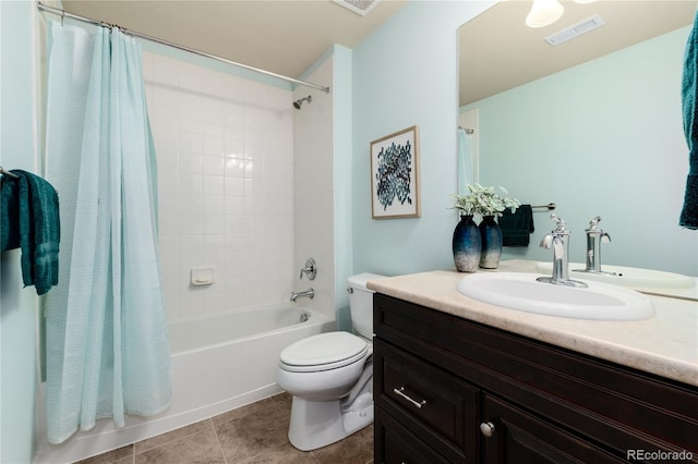 full bathroom with visible vents, vanity, toilet, tile patterned floors, and shower / bath combo