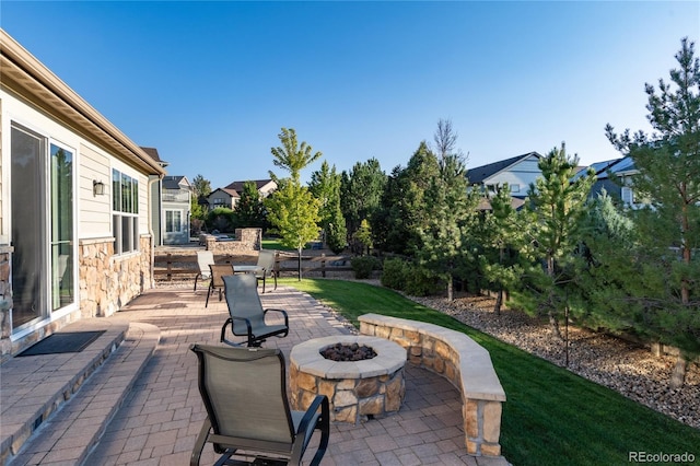 view of patio with a fire pit