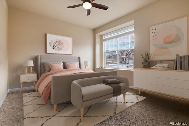 carpeted bedroom with a ceiling fan and baseboards