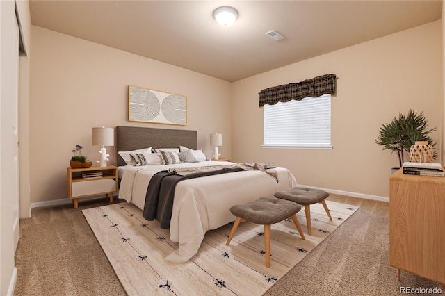 bedroom featuring baseboards, visible vents, and light carpet