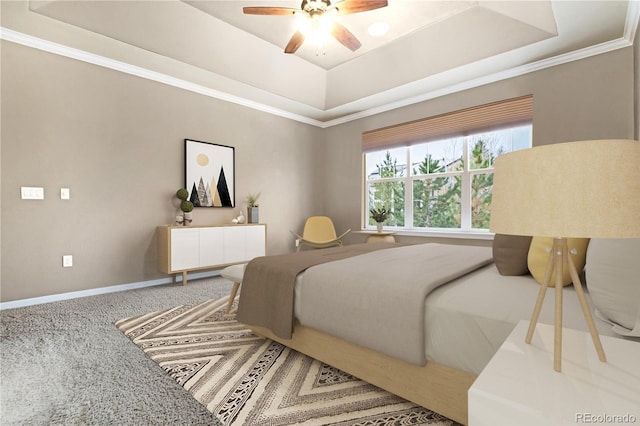 carpeted bedroom featuring baseboards, ornamental molding, a ceiling fan, and a tray ceiling