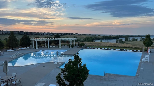 27235 E Lakeview Pl, Aurora, CO 80016 - pool at dusk with a pergola and a community pool