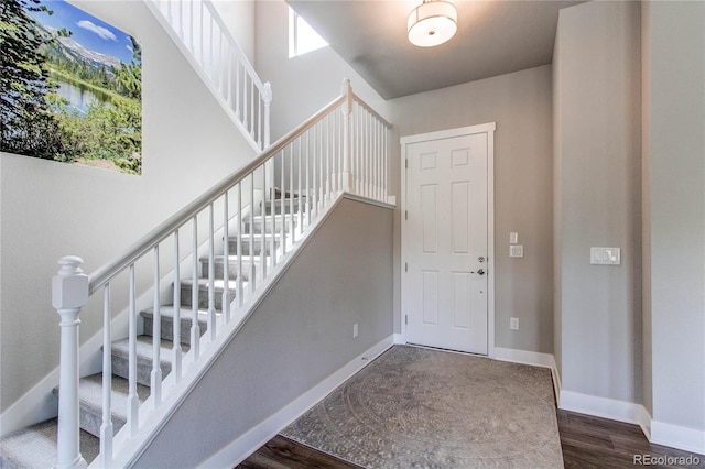 9571 Yucca Ct, Arvada, CO 80007 - staircase with wood finished floors and baseboards