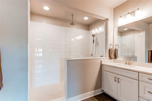 9571 Yucca Ct, Arvada, CO 80007 - bathroom with a walk in shower, vanity, and baseboards