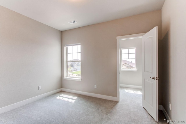 9571 Yucca Ct, Arvada, CO 80007 - empty room featuring plenty of natural light, light colored carpet, and baseboards