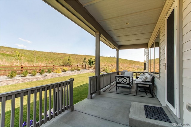 9571 Yucca Ct, Arvada, CO 80007 - covered porch with a yard