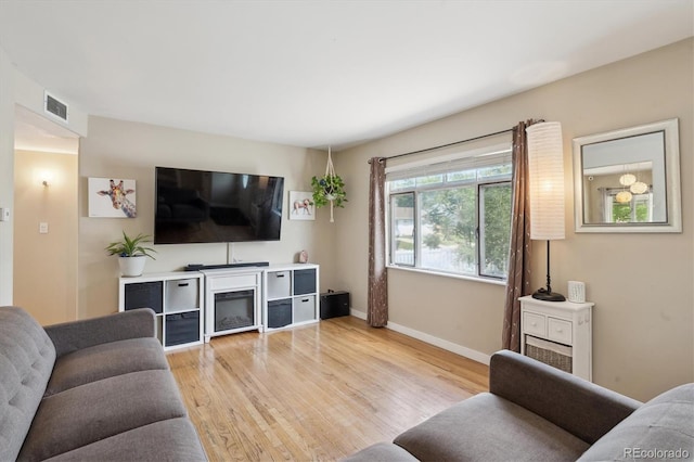 1817 S Perry Way, Denver, CO 80219 - living room featuring wood finished floors