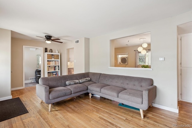 1817 S Perry Way, Denver, CO 80219 - living area featuring wood finished floors and a ceiling fan