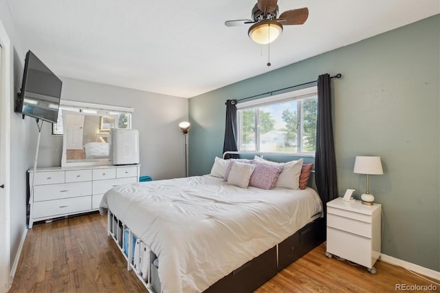 1817 S Perry Way, Denver, CO 80219 - bedroom with wood finished floors and a ceiling fan