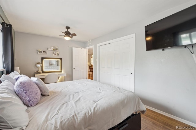 1817 S Perry Way, Denver, CO 80219 - bedroom with wood finished floors, ceiling fan, and a closet