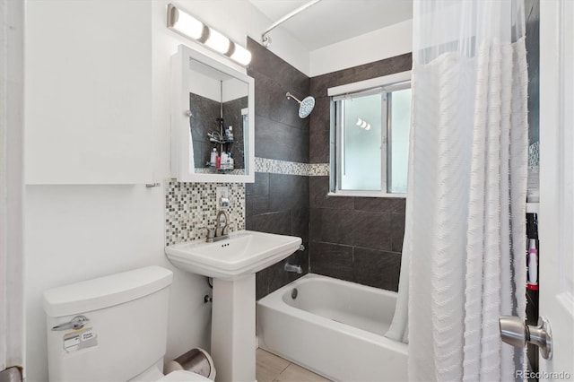 1817 S Perry Way, Denver, CO 80219 - bathroom with shower / bath combo, tile patterned floors, and backsplash