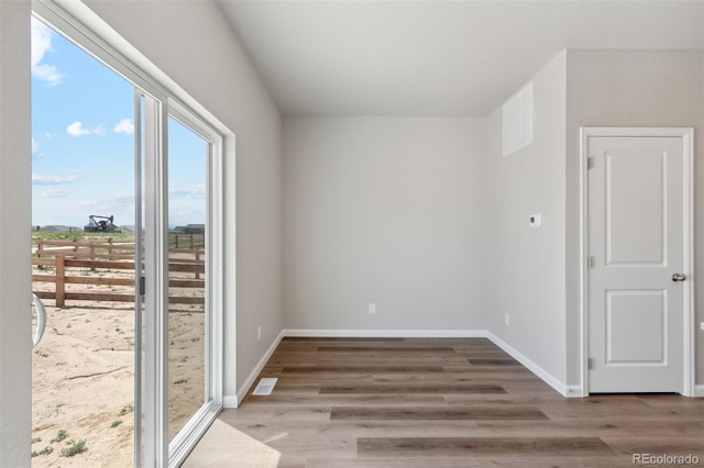 empty room featuring hardwood / wood-style flooring