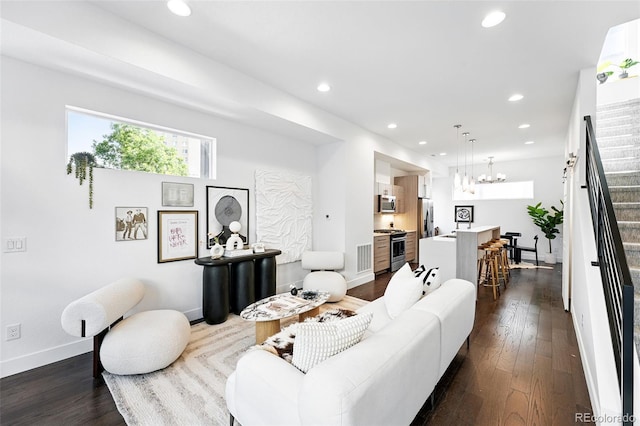 2830 W 32nd Ave, Denver, CO 80211 - living room with recessed lighting, dark wood-style flooring, a chandelier, and stairs