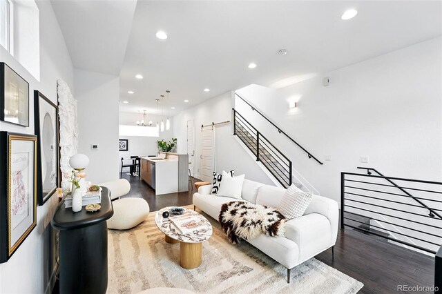 2830 W 32nd Ave, Denver, CO 80211 - living room with a barn door, dark wood finished floors, recessed lighting, and a chandelier
