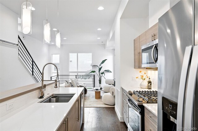2830 W 32nd Ave, Denver, CO 80211 - kitchen featuring stainless steel appliances, light countertops, recessed lighting, dark wood-style floors, and tasteful backsplash